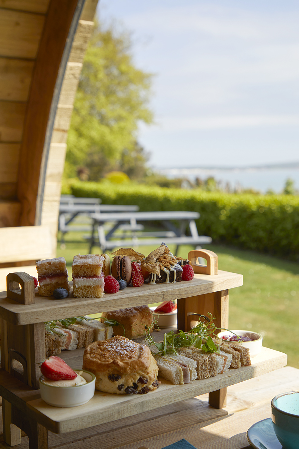 Afternoon tea in a garden pod with a sea view